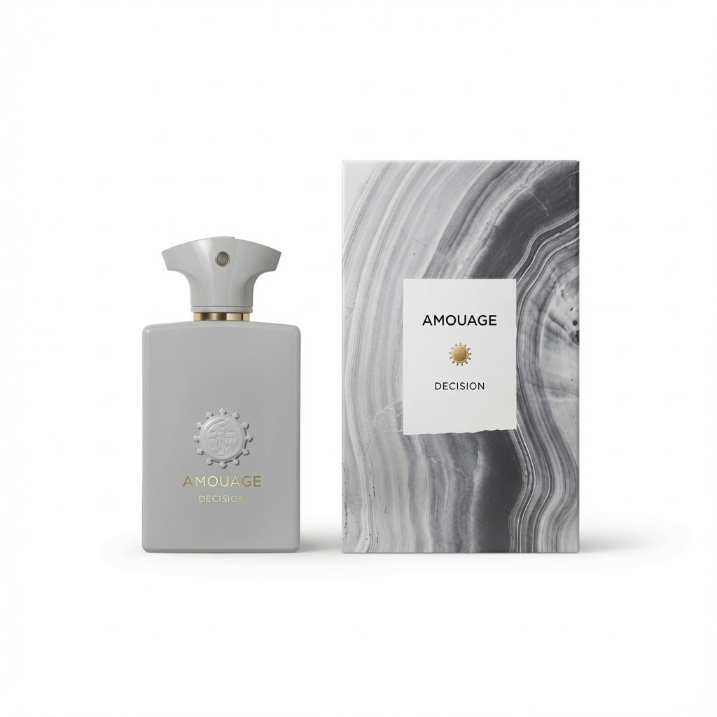 Amouage Decision fragrance bottle in a matte light gray finish with a gold-toned collar and matching cap, standing next to its packaging box which features a gray and white marbled pattern and a white label.